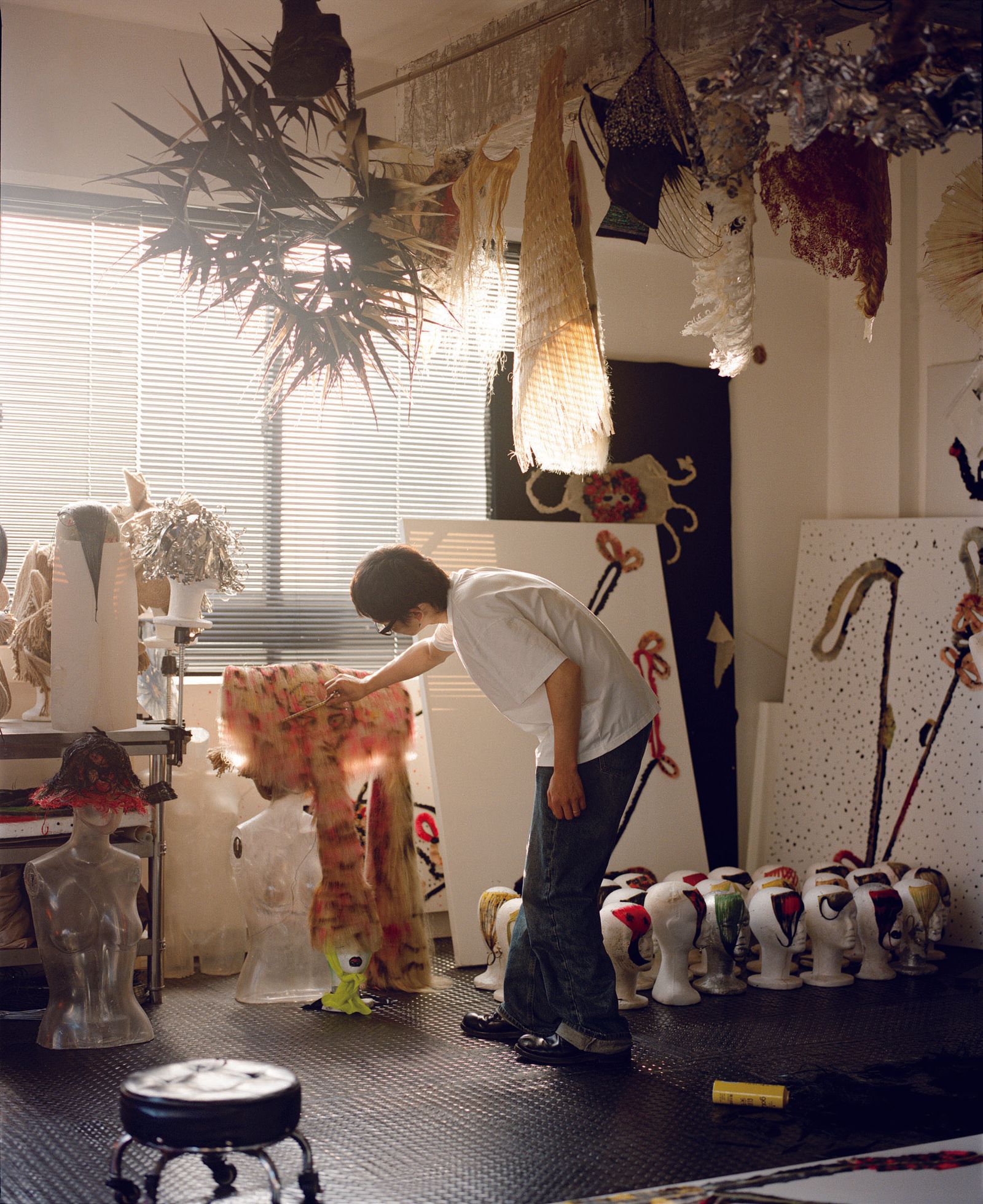 Image may contain Dressing Room Indoors Room Adult Person Clothing Dress Lamp and Child