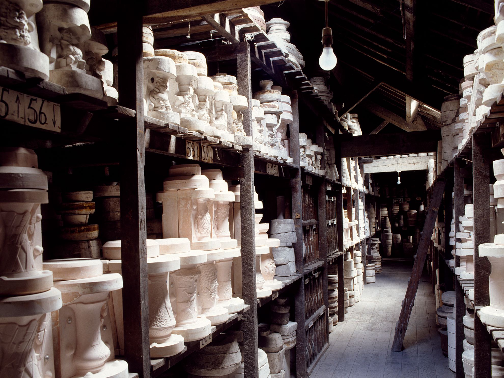 Image may contain Person Lamp Pottery Baby Architecture Building Warehouse Clothing and Hat