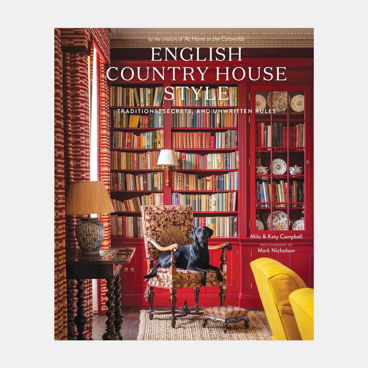 Image may contain Lamp Chair Furniture Indoors Interior Design Book Publication Library Home Decor Rug and Desk