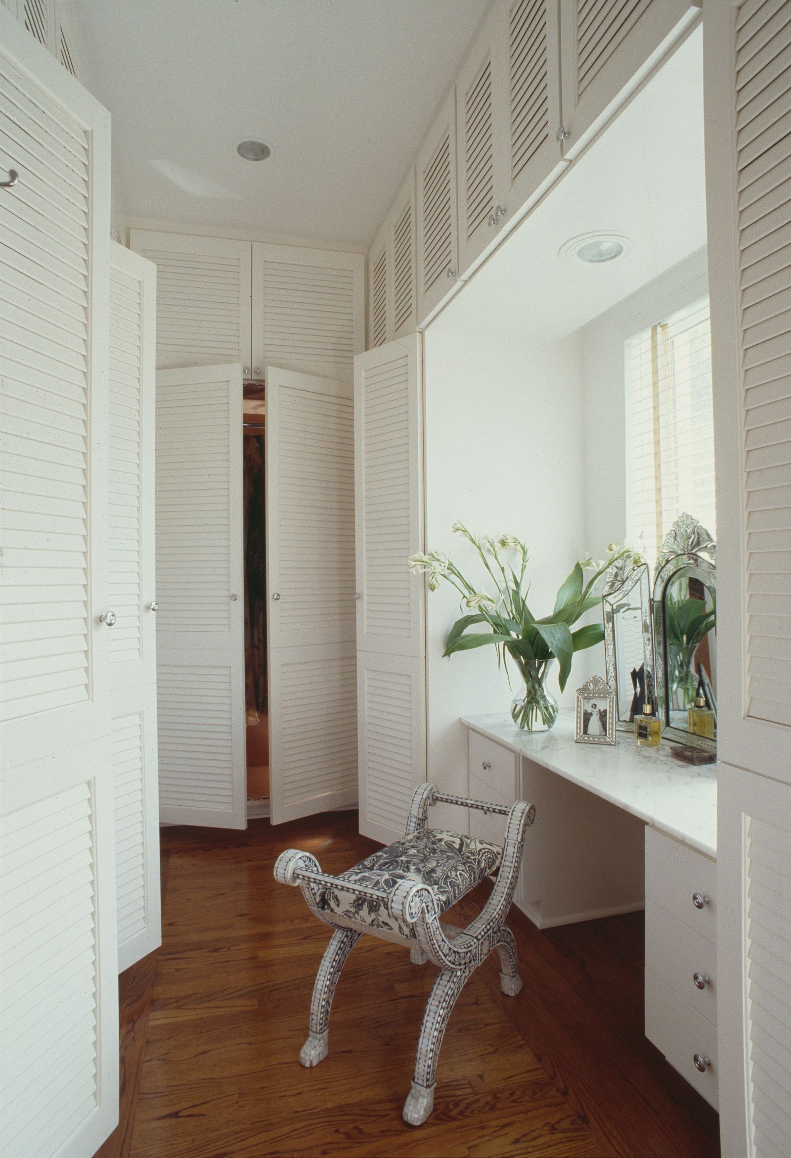 Image may contain Indoors Interior Design Plant Dressing Room Room Chair Furniture Home Decor Floor Door and Wood